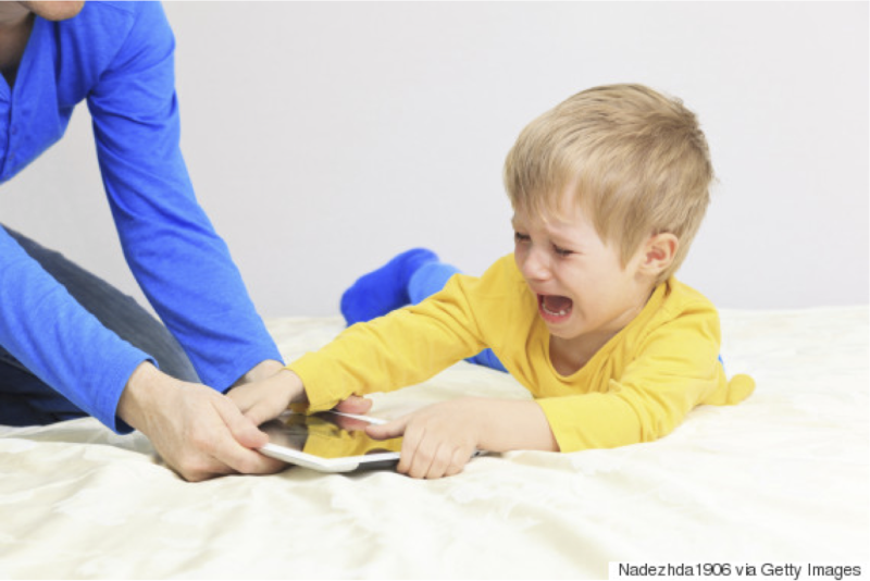 child cries as parent takes away ipad